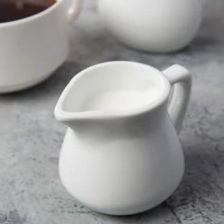 Acopa 3.5 Oz. Bright White Porcelain Creamer - 12/Pack