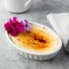 Acopa 5 Oz. Oval Bright White Fluted Porcelain Souffle / Creme Brulee Dish - 12/Pack
