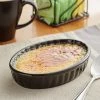Acopa 6 Oz. Oval Glossy Black Fluted Stoneware Souffle / Creme Brulee Dish - 36/Case -Acopa Shop 2174274